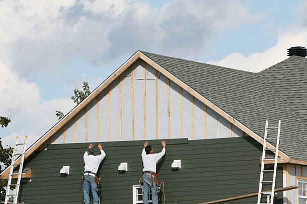 Professional Vinyl Siding technician working in Wellesley, MA